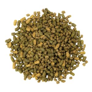 a pile of extruded horse feed against a white background
