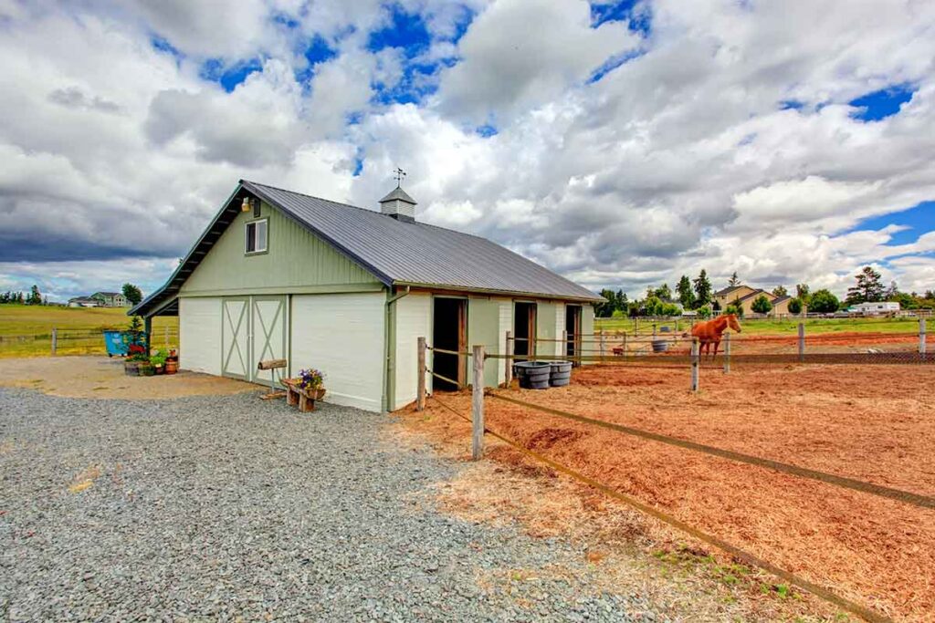 small horse farm barn and paddocks